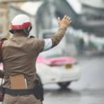 Thai police officers allegedly extort 165,000 USDT from foreign national using fake warrant. 7 suspects arrested; investigation ongoing in Bangkok.